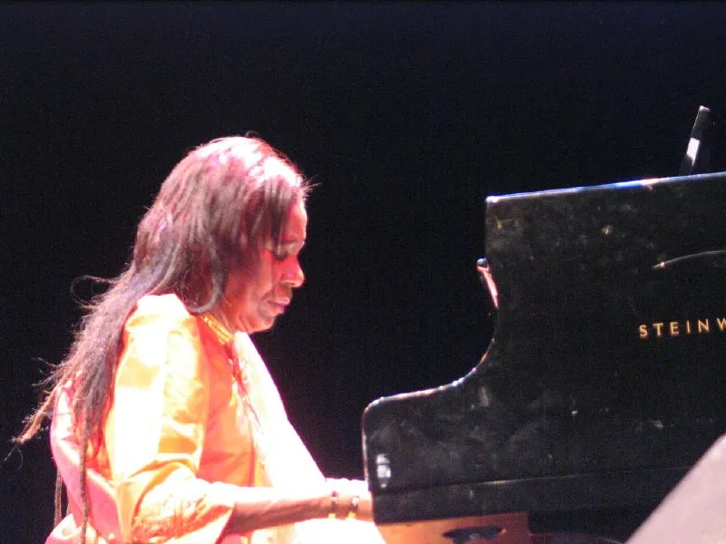 Alice Coltrane seated at a performance in 2006, seen from the audience.