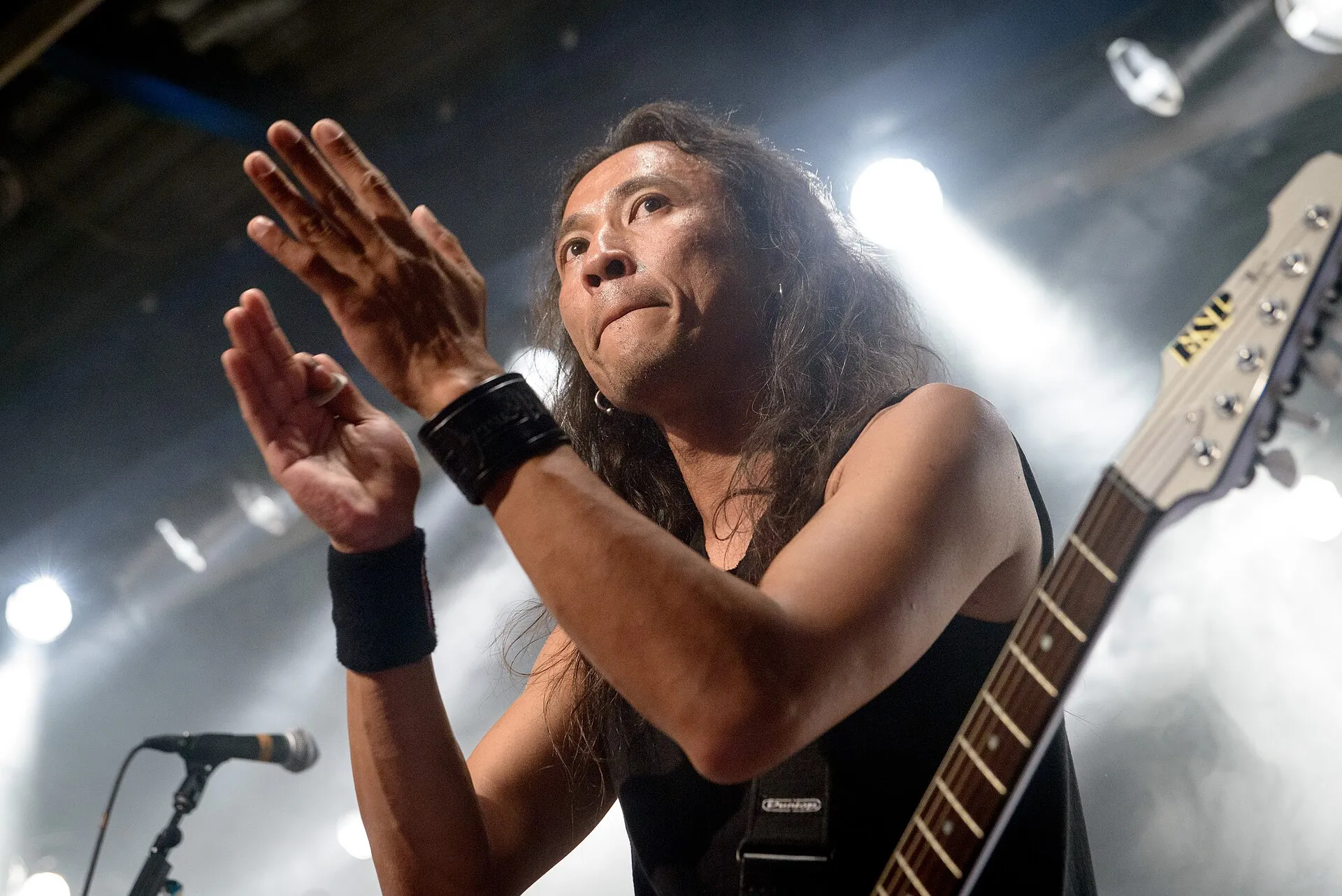 Death Angel performs under red and blue stage light at Munich’s Free and Easy Festival in 2015.