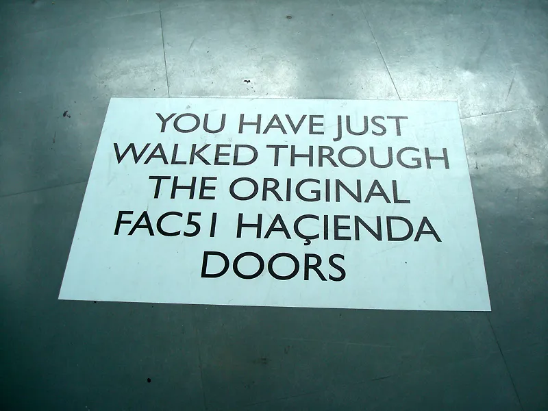 A metal floor sign in Manchester identifying the former location of the Haçienda nightclub and its Factory catalog number FAC 51.