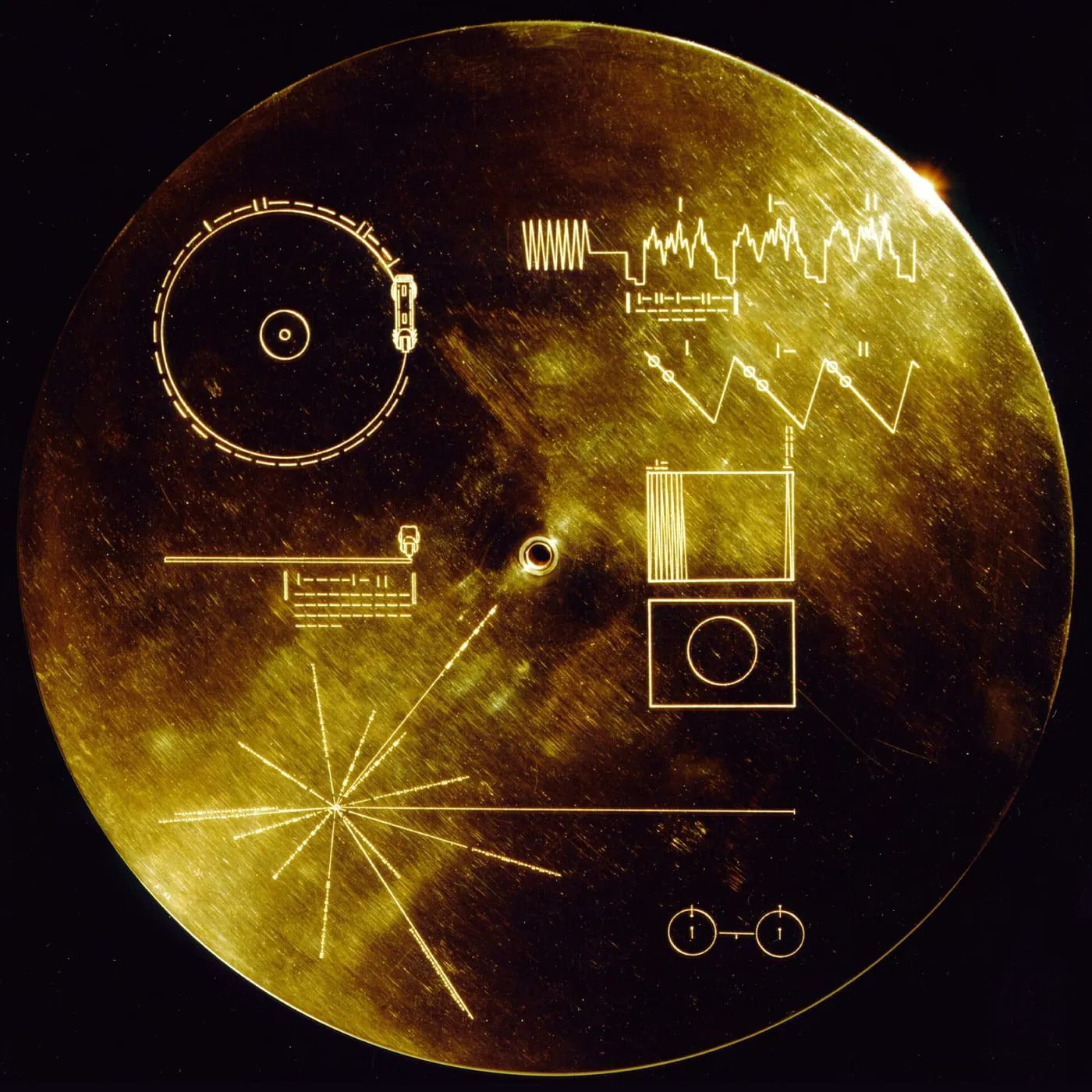 Archive image: Voyager Golden Record This gold aluminium cover was designed to protect the Voyager 1 and 2 Sounds of Earth gold-plated records from micrometeorite bombardment, but also serves a double purpose in providing the finder a key to playing the record. The explanatory diagram appears on both the inner and
