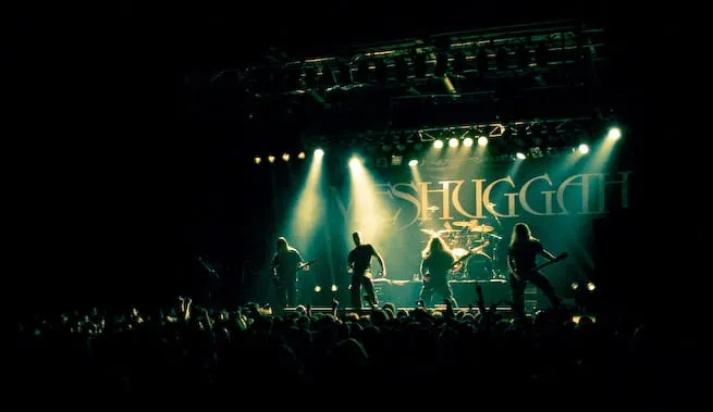 Meshuggah performing as a full band under blue concert lighting in Melbourne in October 2008.