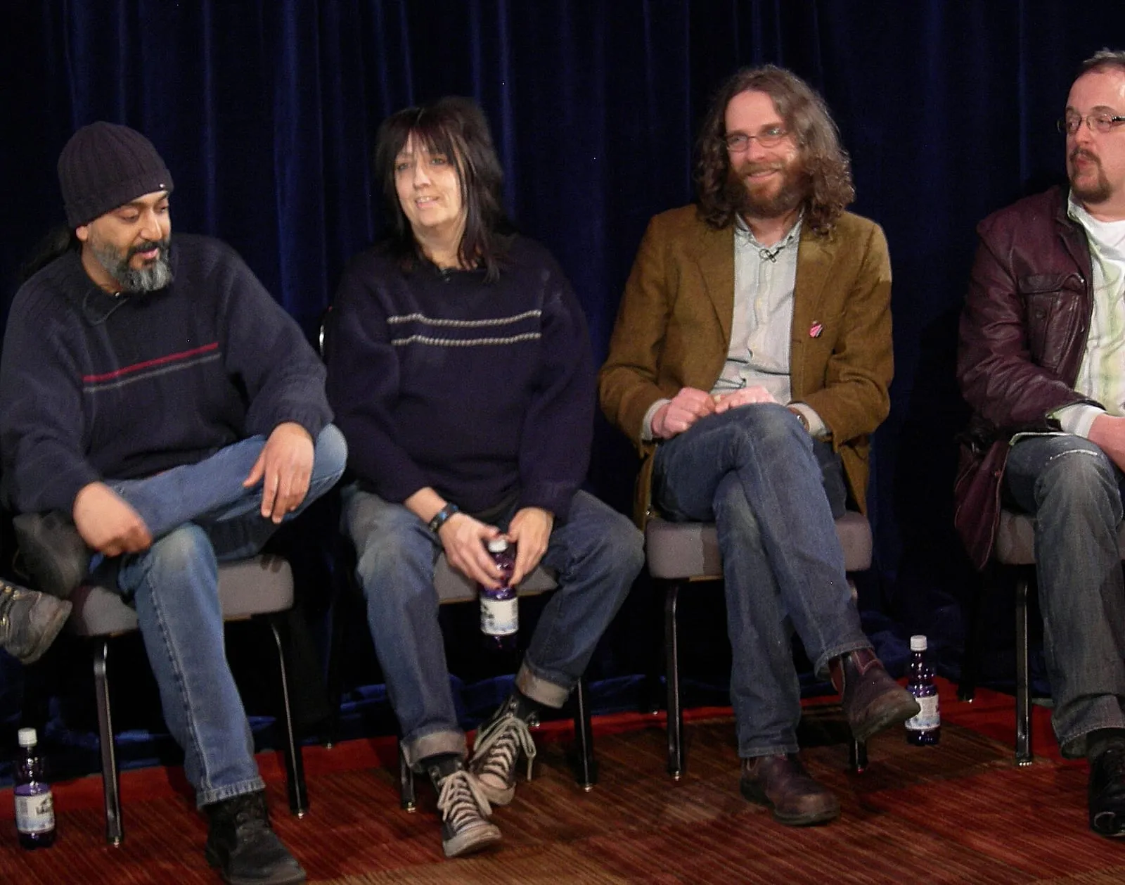 Kim Thayil, Kim Warnick, Steve Turner, and Steve Fisk seated together during a Seattle music panel.