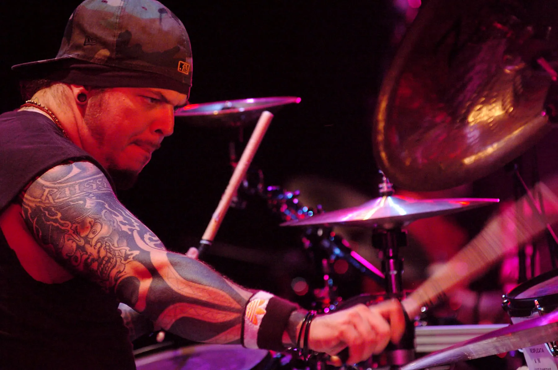 Iggor Cavalera seated at a drum kit during a performance in São Paulo in 2006.