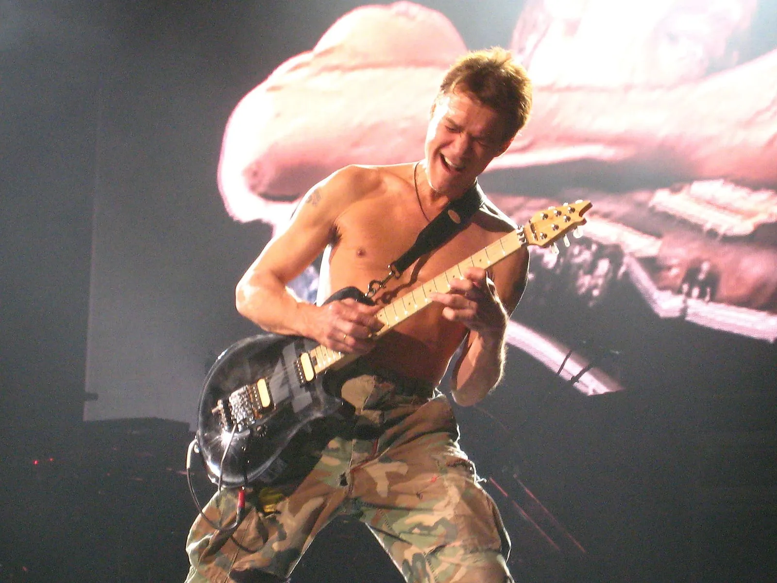 Archive image: Eddie Van Halen shredding his guitar while playing Eruption. Taken at The Van Halen Tour featuring David Lee Roth (lead vocals), Eddie Van Halen (guitars), Wolfgang Van Halen (bass) and Alex Van Halen (drums). The concert was held at Bell Center, Montreal on 10th November, 2007.